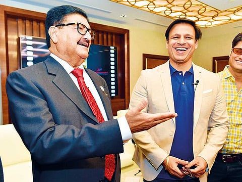 Dr. B.R. Shetty shares a light moment with Bollywood actor Vivek Oberoi.