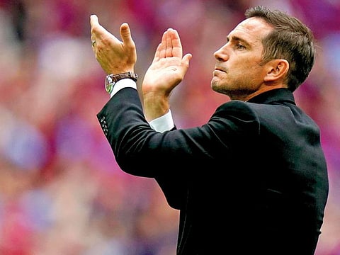 Derby County manager Frank Lampard applauds the fans after his team lost the English Championship Play-off soccer final between Aston Villa and Derby County at Wembley Stadium, London, Monday, May 27, 2019.