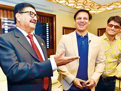 Vivek Oberoi with UAE businessman BR Shetty and 'PM Narendra Modi' producer Sandip Ssingh.