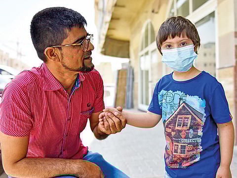 Mohammad Siddiq with his six-year-old son Ebrahim, who has Down syndrome and was diagnosed with acute myeloid leukaemia.