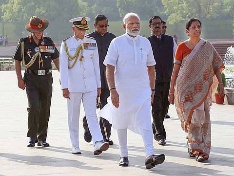 Prime Minister Narendra Modi along with Defence Minister Nirmala Sitharaman arrives to pay tribute at the War Memorial ahead of his swearing-in ceremony as the prime minister for the second consecutive term, in New Delhi, Thursday, May 30, 2019.