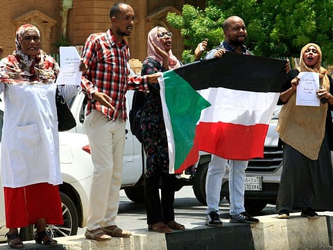 Sudanese protesters gather during a demonstration outside the Central Bank in Khartoum on May 29, 2019.