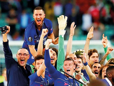 The Chelsea team celebrate after winning the Europa League against Arsenal on Wednesday. Hazard, who confirmed he would leave for Real Madrid this summer, played a key role in the win.