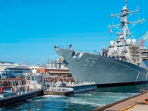 In this file handout photo released by the US Navy on November 27, 2018 the Arleigh Burke-class guided missile destroyer USS John S. McCain (DDG 56) prepares to depart from a dry dock at Fleet Activities Yokosuka, Japan.