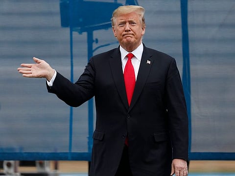 US President Donald Trump waves at the crowd at the U.S. Air Force Academy graduation Thursday, May 30, 2019 at Air Force Academy, Colo.