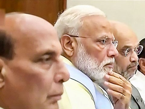 Prime Minister Narendra Modi with Union Ministers Rajnath Singh and Amit Shah during the Cabinet meeting, in New Delhi, on Friday, May 31, 2019.