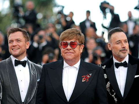 Elton John with David Furnish and Taron Egerton at the 72nd Cannes Film Festival.