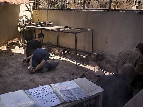 Suspected Daesh fighters detained at a courthouse in Qaraqosh, Iraq, June 15, 2017.