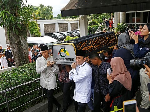 Agus Harimurti Yudhoyono and Edhie Baskoro Yudhoyono carry the casket of their mother and late former Indonesian First Lady Ani Yudhoyono outside the Indonesian embassy in Singapore, June 1, 2019.
