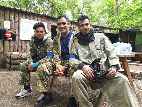 Kuldeep Jadav, M.S. Dhoni and Yuzvendra Chahal.