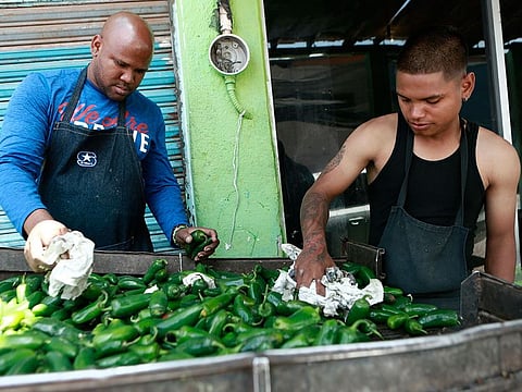 Workers prepare peppers for export from Mexico to the United States, in Ciudad Juarez, Mexico.