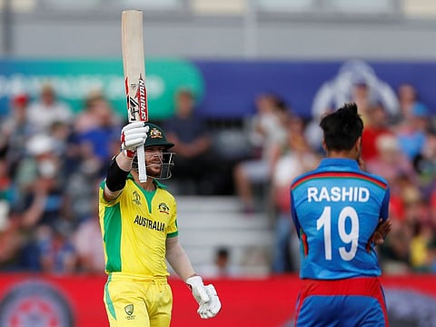 Australia's David Warner celebrates reaching a half century