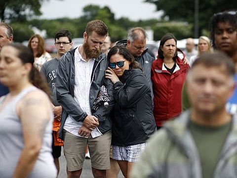 Brittany Myers, right, embraces her husband, Ryan, during a vigil in response to a fatal shooting at a municipal building in Virginia Beach on June 1. A longtime city employee opened fire at the building Friday before police shot and killed him, authorities said.