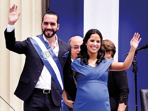El Salvador's newly sworn-in President Nayib Bukele and his wife Gabriela wave during inaugural activities in Plaza Barrios in San Salvador, El Salvador.