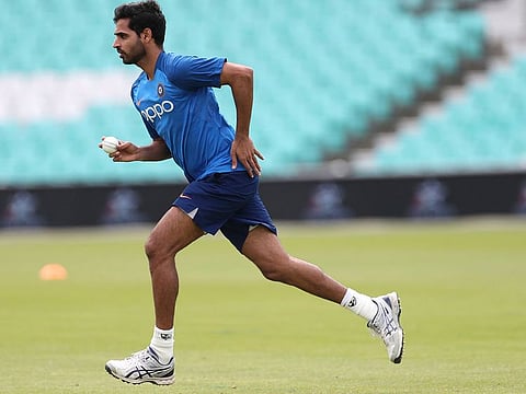 India's Bhuvneshwar Kumar runs to bowl in the nets during a training session at The Oval in London, Friday, May 24, 2019.