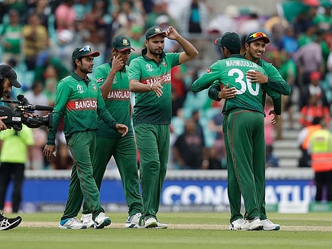 Bangladesh's captain Mashrafe Mortaza, centre, celebrates with his teammates as they walk off after winning by 21 runs in the Cricket World Cup match between South Africa and Bangladesh at the Oval in London, Sunday, June 2, 2019.