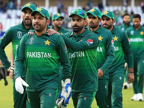 Pakistan's captain Sarfaraz Ahmed (2L) leads his team off of the pitch after winning the 2019 Cricket World Cup group stage match between England and Pakistan at Trent Bridge in Nottingham, central England, on June 3, 2019.