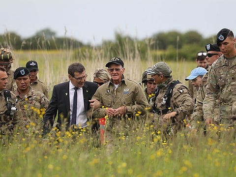 US WWII veteran Tom Rice (C) walks after taking part in a parachute drop over Carentan, Normandy, north-western France, on June 5, 2019, as part of D-Day commemorations marking the 75th anniversary of the World War II Allied landings in Normandy.
