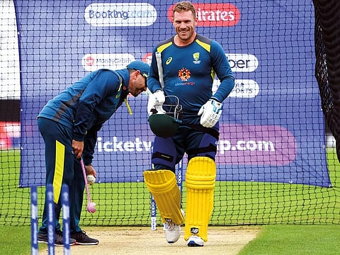 Australia’s captain Aaron Finch enjoys a light moment with head coach Justin Langer at the nets during a training session at Trent Bridge in Nottingham on Wednesday.
