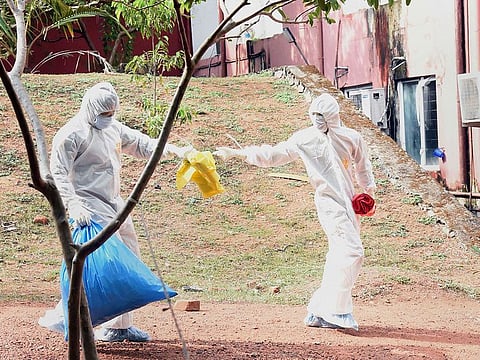Health officials clear waste from isolation ward of Ernakulam Medical College, in Kochi.