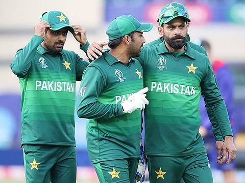 Pakistan's captain Sarfaraz Ahmed, centre, and teammates leave the field after their win over England in the World Cup match at Trent Bridge in Nottingham, on Monday, June 3, 2019.