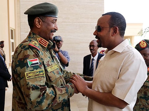 Abdel-Fattah Al Burhan (left) greets Ethiopian Premier Abiy Ahmed on June 7, 2019.
