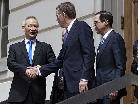 Chinese Vice-Premier Liu He is flanked by US Treasury Secretary Steven Mnuchin and Trade Representative Robert Lighthizer in Washington DC. Bloomberg photo by Alex Edelman