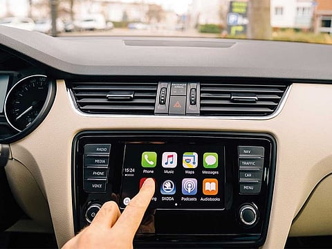 A motorist presses the Now Playing button on the Apple CarPlay main screen. Apple Inc is reportedly preparing to buy start-up Drive.ai in a deal that will bring more engineers with experience in autonomous vehicle technology to the iPhone maker, said reports.