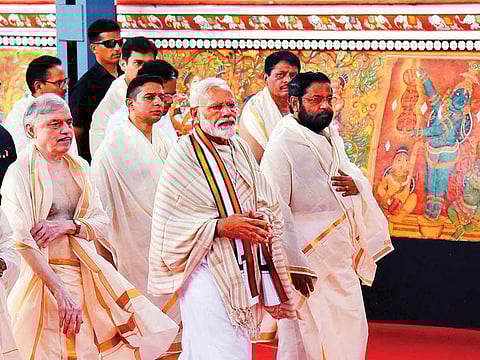 Prime Minister Narendra Modi accompanied by Kerala Governor P. Sathasivam, State Devasom Minister Kadakampally Surendran along with senior Bharatiya Janata Party leaders, arrives to offer his prayers at the temple in Guruvayur.