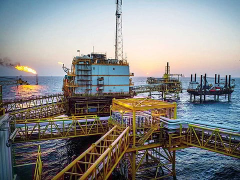 Gas flares burn from pipes aboard an offshore oil platform in the Persian Gulf's Salman Oil Field, near Lavan island, Iran