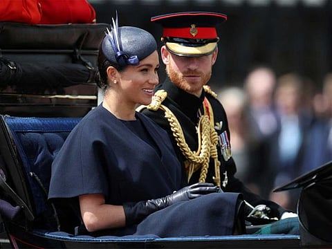 Britain's Prince Harry and Meghan, Duchess of Sussex take part in the Trooping the Colour parade in central London