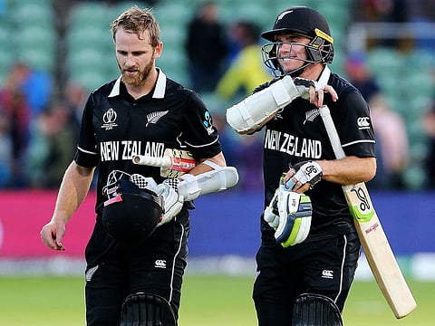 New Zealand's Kane Williamson and Tom Latham leave the pitch after winning the match the Cricket World Cup group stage match against Afghanistan.