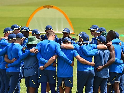 South Africa's players and coaches form a group huddle duirng a training session at the Rose Bowl in Southampton.
