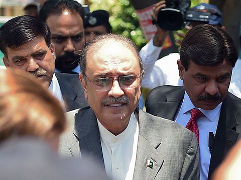 Former Pakistani President and the co-chairperson of Pakistan People's Party (PPP) Asif Ali Zardari (2L) arrives for his bail appeal at Islamabad High Court.