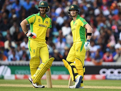 Australia's Steve Smith (right) and Glenn Maxwell speak during the match against India at The Oval in London.