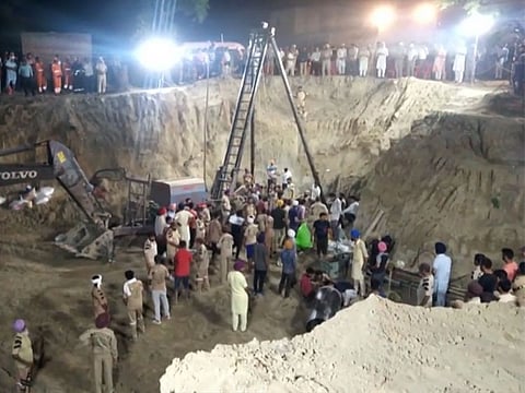 Indian emergency workers scramble to rescue a two-year-old boy trapped down a narrow, disused well for almost four days in the western state of Punjab.