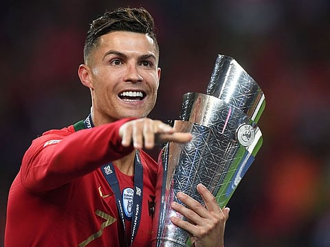 Portugal's forward Cristiano Ronaldo celebrates with the trophy after winning the Uefa Nations League final against the Netherlands at the Dragao Stadium in Porto.