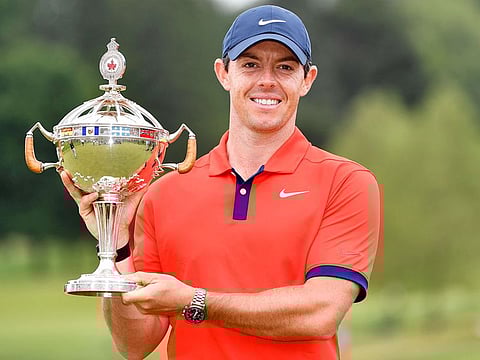 Rory McIlroy poses with the trophy after winning the 2019 RBC Canadian Open golf tournament at Hamilton Golf & Country Club.