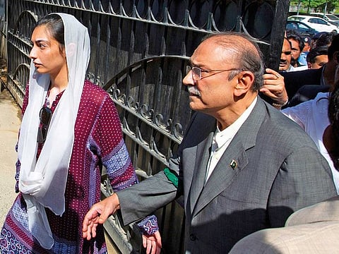 Former President and leader of the Pakistan People’s party Asif Ali Zardari leaves the High Court with his daughter Asifa Bhutto Zardari in Islamabad.