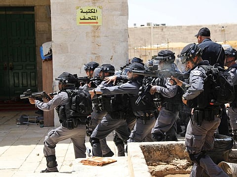 Israeli policemen aim their weapons against Palestinians on "Jerusalem Day" in occupied Jerusalem's Old City on June 2, 2019.