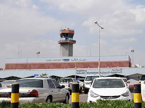 Cars are parked in front of the Abha airport in southwestern Saudi Arabia's mountainous resort, on June 12, 2019.