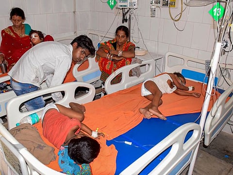Muzaffarpur: Children showing the symptoms of  Acute Encephalitis Syndrome (AES) being treated at a hospital in Muzaffarpur, Tuesday, June 11, 2019.  At least a dozen of children in the city have died due to the disease while many others are being treated in several hospitals. (PTI Photo)    (PTI6_11_2019_000098B)