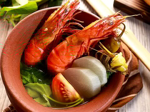 Sinigang, a meat and vegetable soup, is popular with both Filipinos and other expats