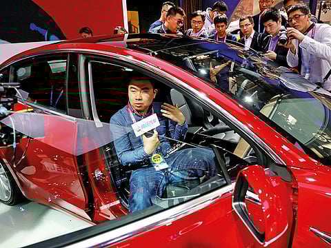 The Tesla Model 3 is displayed during a recent media preview in Beijing.