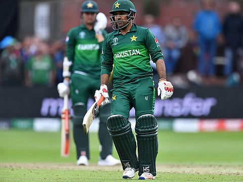 Pakistan's captain Sarfaraz Ahmad walks off the field after defeat.