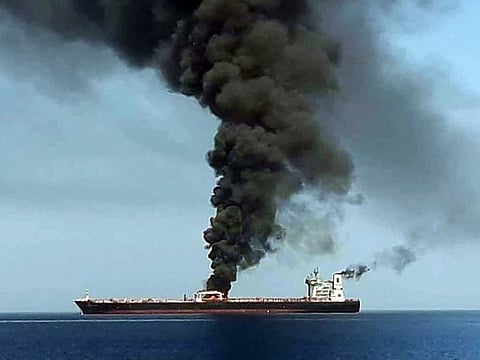 Illustrative image. A file picture of smoke billowing from a tanker said to have been attacked off the coast of Oman.