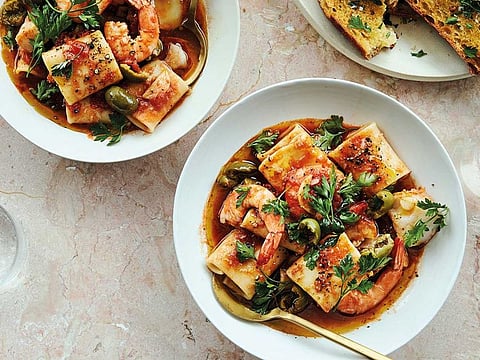 Think of the sauce for Alison Roman’s seafood pasta as a very casual, one-pot bouillabaisse, infinitely riffable and ready in a fraction of the time. Fat tube pasta, such as paccheri or rigatoni, are great for catching every bit of sauce in this versatile recipe.