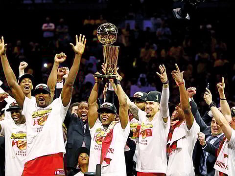 The Toronto Raptors celebrate after defeating the Golden State Warriors to win the NBA Finals.