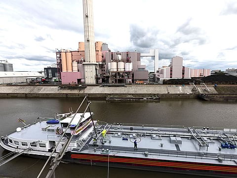 A cantilevered inlet pipe sits connected to oil tanker 'Erik Walther' during an oil delivery at the Erik Walther GmbH oil terminal on the River Rhine in Schweinfurt, Germany.