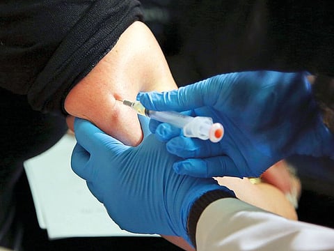 In this March 27, 2019 file photo, a woman receives a measles, mumps and rubella vaccine at the Rockland County Health Department in Pomona, N.Y., north of New York City.